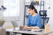 © David - Asian Business woman work in home. concept of tax, report, accounting, statistics, and analytical research.