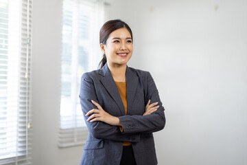 Young asian woman, professional entrepreneur standing in office clothing, smiling and looking confident, home office background