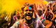 excited young man at holi festival celebration joy colors