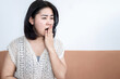 lack of sleep ,sleep deprivation concept with Asian woman yawning , sleepy and fatigue during daytime