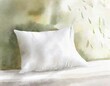 Watercolor of hypoallergenic pillow on a queen size bed