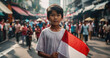 Indonesian boy holding Indonesia flag in Jakarta street 