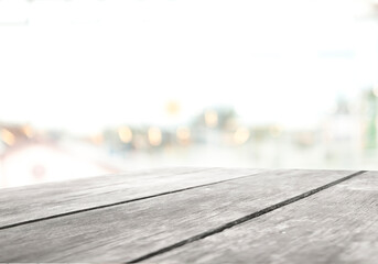 Poster - Perspective light empty wooden table from above on blurred background can be used mockup to display installation products or design layout.