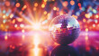Retro disco dance background. Glowing disco mirror ball on the multi-colored lights bokeh of a night party. Vintage Event Invitation