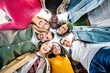 © Davide Angelini - Multi racial group of friends standing in circle smiling at camera together - Group of young people taking selfie portrait outside - Youth community with guys and girls hanging out