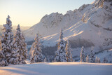 Fototapeta Las - Snowy Austrian Alps during the sunset. Picturesque winter background 