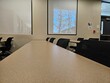 Empty classroom interior, with rows of desks
