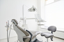 Dentist's Office Interior With Modern Chair And Special Dentisd Equipment. Dentist Office. Dentist Chair In High Class Dental Clinic. Dentist Office. Medical Concept.