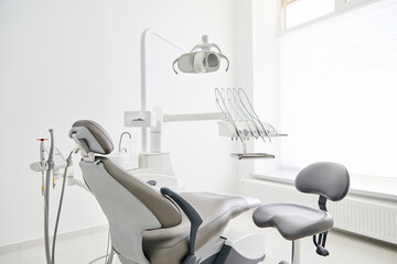 Dentist's office interior with modern chair and special dentisd equipment. Dentist office. Dentist chair in high class dental clinic. Dentist office. Medical concept.