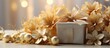 gift box and golden flowers on copy space view. bright background
