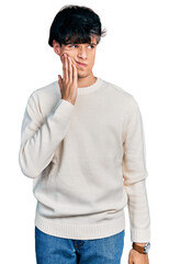 Sticker - Handsome hipster young man wearing casual winter sweater touching mouth with hand with painful expression because of toothache or dental illness on teeth. dentist