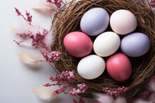 Top View Of Nest With Easter Eggs On White Background