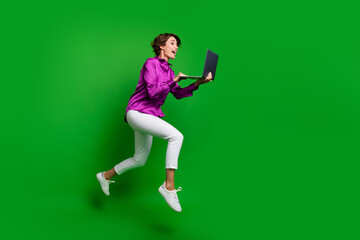 Sticker - Full length profile portrait of attractive person jump rush use laptop empty space ad isolated on green color background