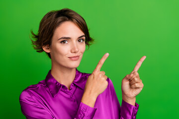 Sticker - Photo of lovely cute lady wear pink stylish clothes two arms demonstrate empty space poster isolated on green color background