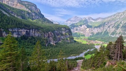 Poster - scenic Hiking route to Oeschinensee lake. Switzerland nature .Idyllic swiss scenery with snowy peaks of Alps mountains near Kandersteg village .
