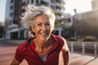 © ShniDesign - Fitness older woman running outside in the morning. Active healthy lifestyle among seniors.