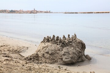 Canvas Print - Beach sand castle in Alghero town, Sardinia Italy