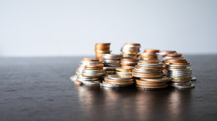 Stack of silver coins on a table. Stock trading and investing. Business and finance. Saving and investing for the future and retirement.