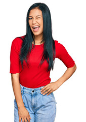 Poster - Beautiful hispanic woman wearing casual clothes winking looking at the camera with sexy expression, cheerful and happy face.