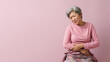 © pariketan - Senior Asian woman wincing in pain and hand rubbing stomach