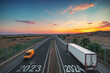 2024 Happy New Year.Driving on open road at beautiful sunset. Aerial view