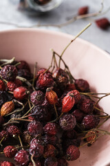 Wall Mural - Sun dried organic rosehip berries, sustainable resources, ready to preparing  herbal tea, close up