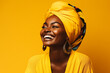 photography, an africanwoman smiles in the studio on yellow background. happy model