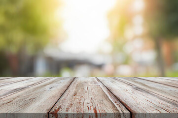 Wall Mural - Wooden table or surface with blurred summer forest background