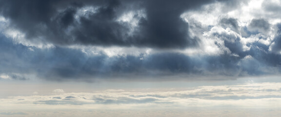 Wall Mural - dark clouds over the stormy sky, panoramic photo. natural background