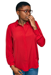 Sticker - Young african american woman wearing casual clothes and glasses looking stressed and nervous with hands on mouth biting nails. anxiety problem.