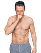 © Krakenimages.com - Handsome young man wearing swimwear shirtless feeling unwell and coughing as symptom for cold or bronchitis. health care concept.
