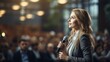 © jp - Jeune femme avec micro en pleine conférence ou séminaire