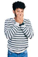 Poster - Young arab man with beard wearing casual striped sweater laughing and embarrassed giggle covering mouth with hands, gossip and scandal concept