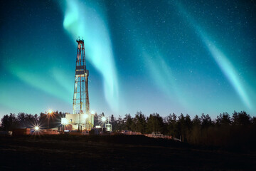 Wall Mural - aurora borealis northern lights over oil gas drilling rig. industrial concept