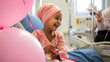 © MP Studio - A child cancer patient in a hospital room spends time with his mom