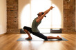 © ADDICTIVE STOCK - Man practicing yoga in a sunlit room
