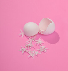 Wall Mural - Creative layout with starfish and eggshell on bright pink background. Visual summer trend. Minimalistic aesthetic still life with shadow. Fresh idea