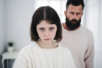 Offended teenage girl and middle aged man avoid to talk after quarrel at home, upset daughter and strict father argument, family conflict, adolescence problem