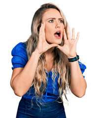 Canvas Print - Young blonde woman wearing casual clothes shouting angry out loud with hands over mouth