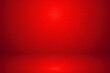 Abstract red gradient background for product placement or website.  Empty room with copy space and spotlight for product presentation