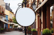 Company branding in focus with a round white sign mockup in a country city