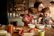 © Davor - Little boys eating cereal with dad at home