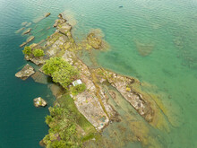 Aerial Drone Photo Of Small Islands On A Clear Blue Lake.