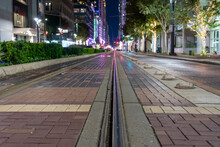 Night Time Photo Of Street Car, Trolly, Train Tracks In Houston Texas.
