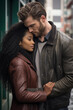 © ana - Young Interracial Couple Concept - handsome young man wearing a winter jacket embracing a pretty black African american woman wearing a leather jacket