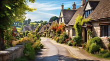 Beautiful Idyllic Old English Village Street With Cottages Made Of Stone And Front Garden With Flowers