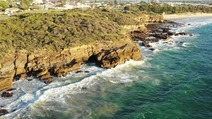 Canvas Print - Along sea cases sandstone rocks in Caves beach of Australian pacific coast 4k.
