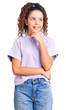 © Krakenimages.com - Beautiful kid girl with curly hair wearing casual clothes with hand on chin thinking about question, pensive expression. smiling with thoughtful face. doubt concept.