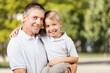 © BillionPhotos.com - Playful father have fun with son in park