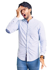 Poster - Handsome hispanic man wearing business shirt and glasses yawning tired covering half face, eye and mouth with hand. face hurts in pain.